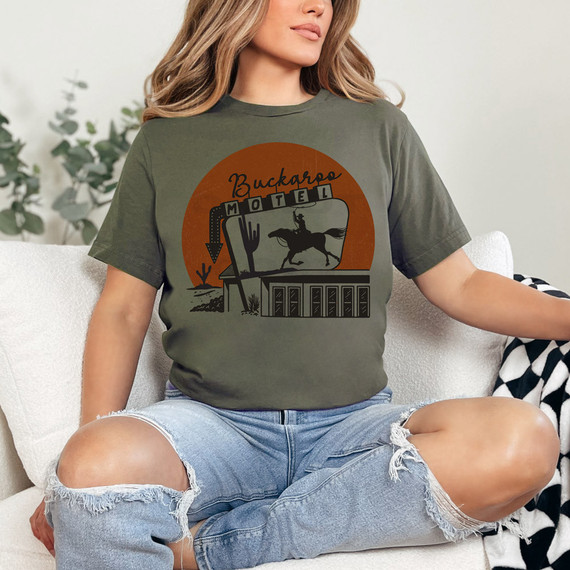Buckaroo Motel DTF Heat Transfer, vintage style cowboy and motel sign design on a woman wearing a T-shirt.