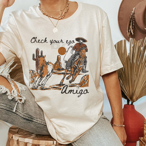 Check Your Ego Amigo DTF Heat Transfer T-shirt with cowboy and cactus graphic design.