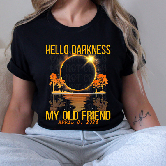 Hello Darkness Total Eclipse DTF Heat Transfer, a design featuring a solar eclipse with orange trees and reflection on water, with text 'Hello Darkness', 'My Old Friend', and date 'April 8, 2024'.