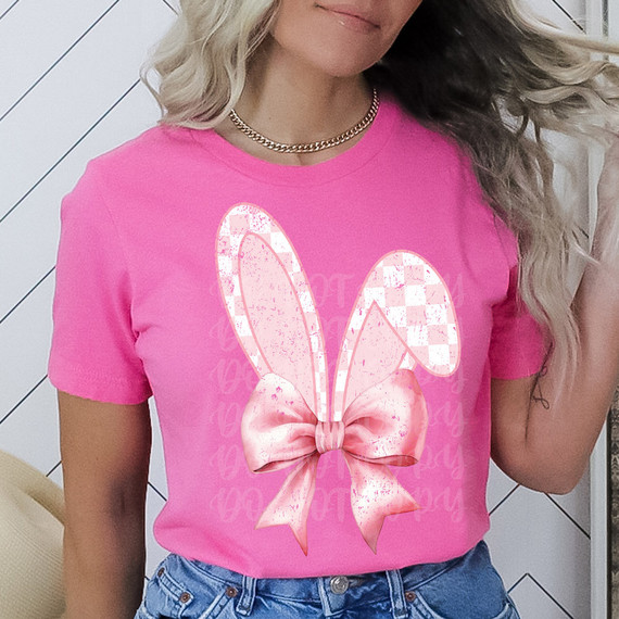 Coquette Bow Bunny Ears DTF Heat Transfer, pink bunny ears with a bow design on a pink T-shirt.