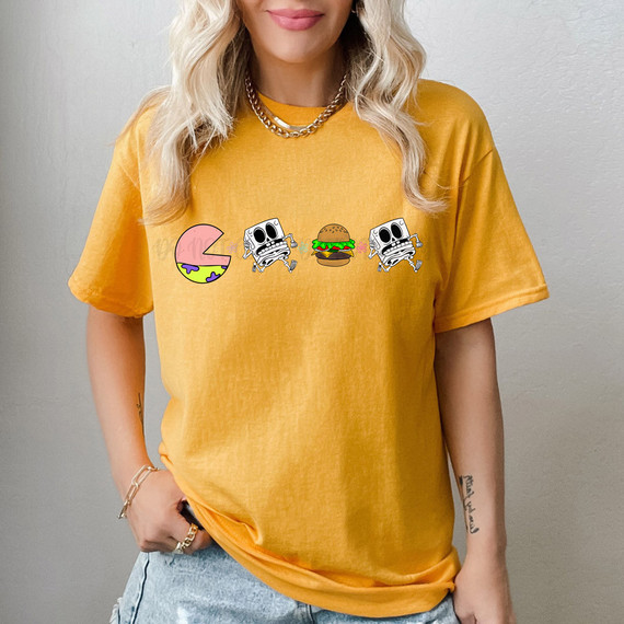 Patrick Pac DTF Heat Transfer, colorful cartoon design featuring a watermelon slice, skeletons, and a hamburger printed on a yellow T-shirt.