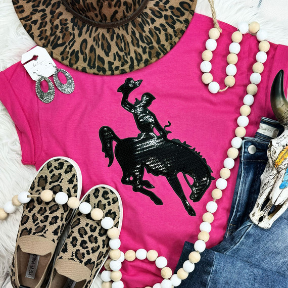 Rodeo Cowboy and Horse Sequin Patch, colorful fashion flat lay with pink graphic t-shirt, leopard print sneakers, beaded necklaces, cow skull, and animal print hat.