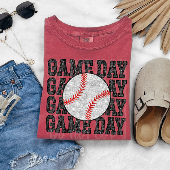 Game Day Baseball Faux Spangle DTF Heat Transfer, close-up image of a heat transfer design featuring a baseball with red stitches and a mocked distressed black text background on a pink T-shirt.