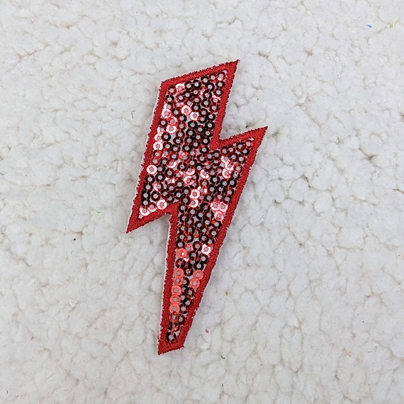 RED Sequin Lightning Bolt HAT/POCKET Patch, vibrant red sequin lightning bolt patch with a glittering shiny surface.