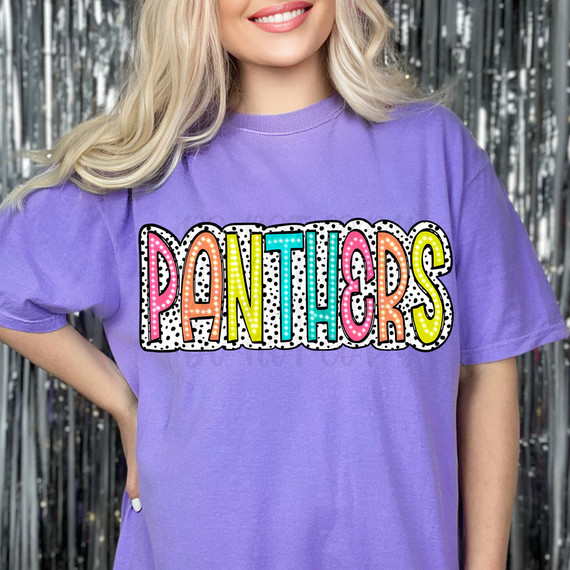 Panthers Dalmatian Dots DTF Heat Transfer, colorful and playful graphic design on a purple t-shirt featuring the word 'PANTHERS' with polka dot accents.