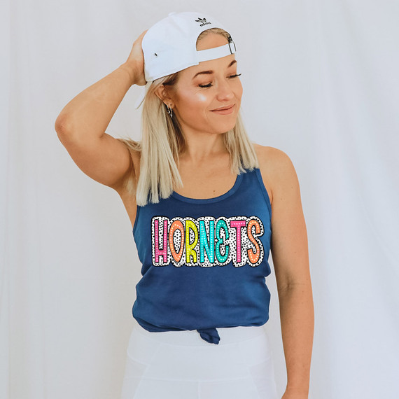 Hornets Dalmatian Dots DTF Heat Transfer, colorful and playful heat transfer design on a woman's blue tank top.