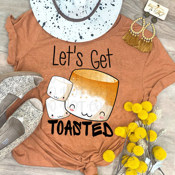 Let's Get Toasted DTF Heat Transfer, humorous design featuring marshmallows and a toasted marshmallow character on a brown t-shirt.