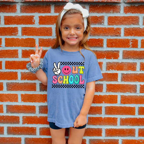 Peace Out School DTF Heat Transfer, colorful graphic design on a blue children's T-shirt with a girl making a peace sign