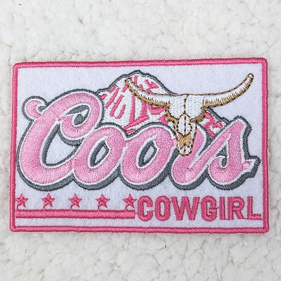 Coors Cowgirl Embroidered HAT/POCKET Patch, pink and white embroidered patch featuring the word 'COORS' with a longhorn skull and pink stars.