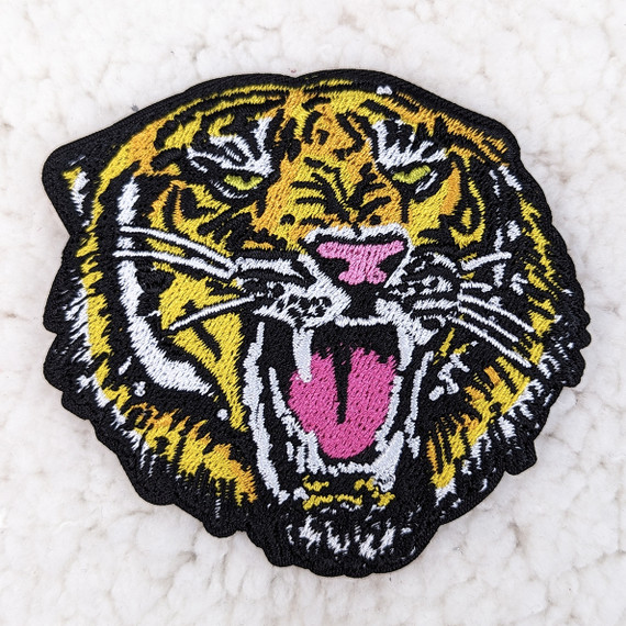 Wild Tiger 3" Embroidered HAT/POCKET Patch, detailed embroidered patch featuring a fierce tiger face with yellow, black, white, and pink thread on a black background.