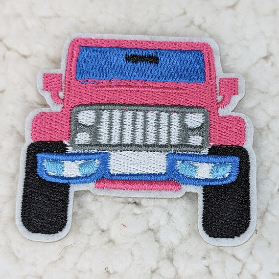 Bright Jeep Embroidered HAT/POCKET Patch, a colorful embroidered patch depicting a pink jeep with blue windows, black tires, and a white outline, suitable for decorating hats or pockets.
