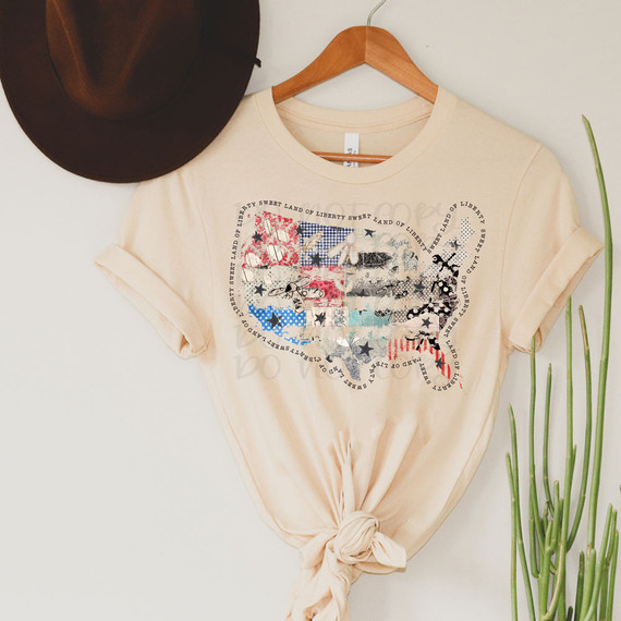 Sweet Land Of Liberty Distressed DTF Heat Transfer, image of a beige t-shirt with a patriotic distressed flag design.