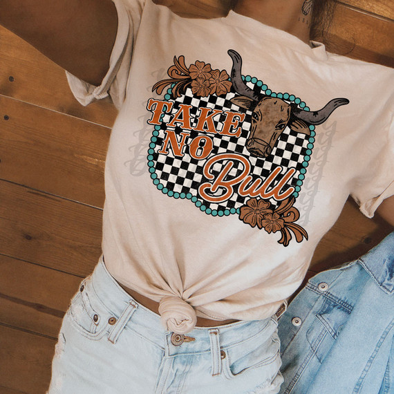Take No Bull Checker DTF Heat Transfer, a colorful graphic design featuring a bull's head with floral and checkered patterns on a white T-shirt.