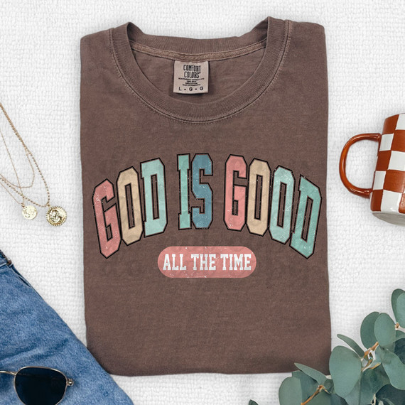 God Is Good All The Time DTF Heat Transfer, brown T-shirt with colorful text design.