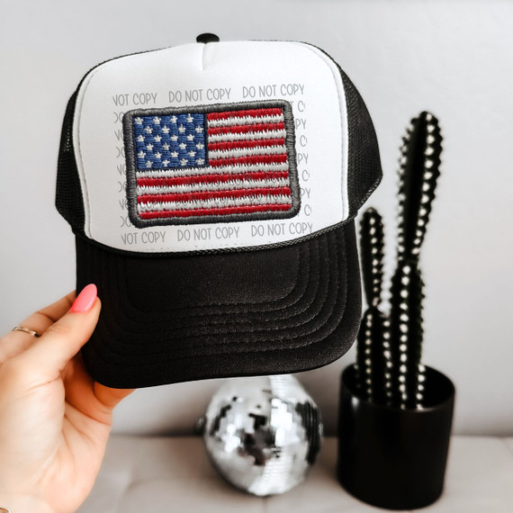 American Flag Faux Patch Sublimation Transfer, embroidered American flag patch on black and white trucker cap.