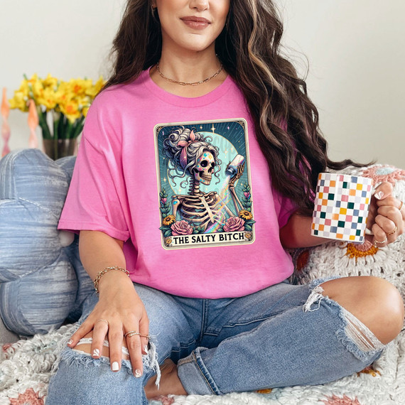 The Salty Bitch Skeleton DTF Heat Transfer, vibrant graphic of a skeleton with a skull and colorful hair, depicting a humorous and edgy design for custom apparel.