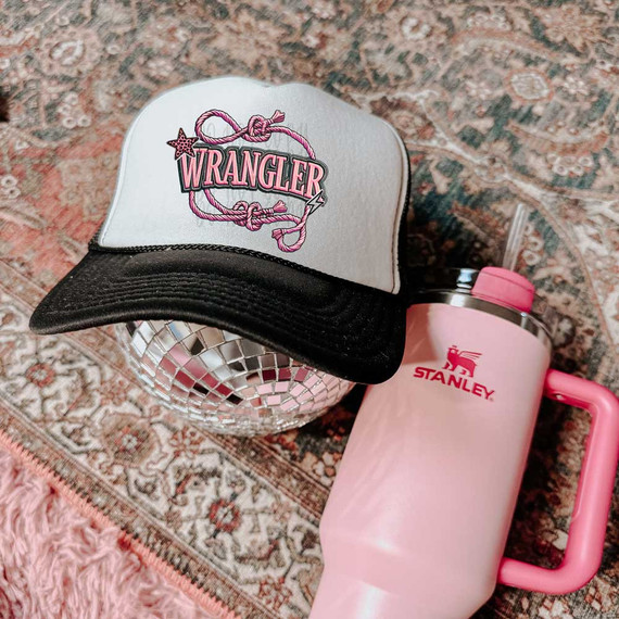 Wrangler Faux Embroidery DTF Heat Transfer, embroidered patch on a white and black trucker hat.