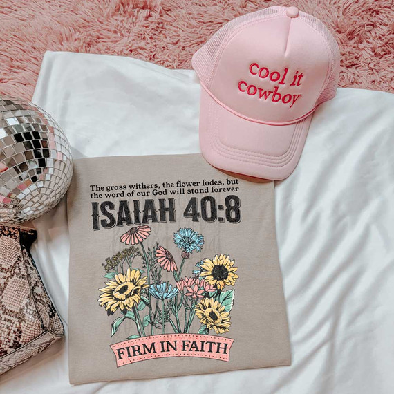 Firm In Faith DTF Heat Transfer, pink cap with 'cool it cowboy' embroidered, with floral-themed fabric featuring Isaiah 40:8 scripture and colorful flowers, on a white and pink background.