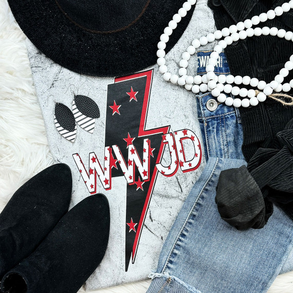 WWJD Screen Print Heat Transfer, patriotic themed apparel with red, white, and black design, featuring stars and text, placed alongside denim jeans, black hat, black shoes, beads, and black clothing items.