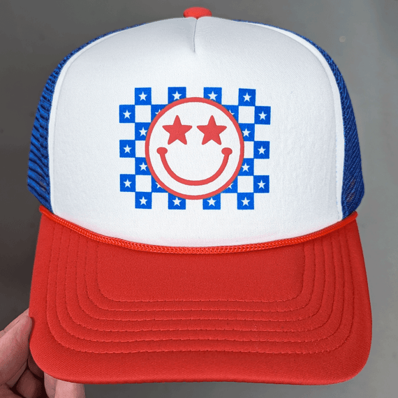 Patriotic PUFF Checkered Happy Face Hat/Pocket Screen Print Heat Transfer, a colorful trucker cap with a smiley face graphic on the front, checkered pattern, and bright red, white, blue design.
