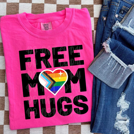 Free Mom Hugs Heart DTF Heat Transfer, pink t-shirt with a colorful heart and rainbow design for LGBTQ pride and support.