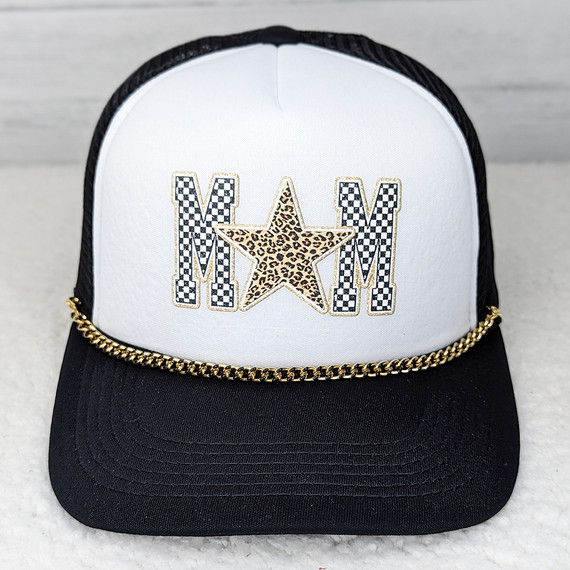 Black Enamel Gold Hat Chain, stylish accessory on a white and black baseball cap with 'MOM' embroidery, featuring a leopard print star and checkered patterns.