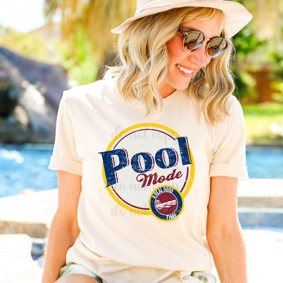 Pool Mode DTF Heat Transfer, colorful woman wearing casual summer outfit with the printed design on t-shirt, outdoor sunny poolside scene.