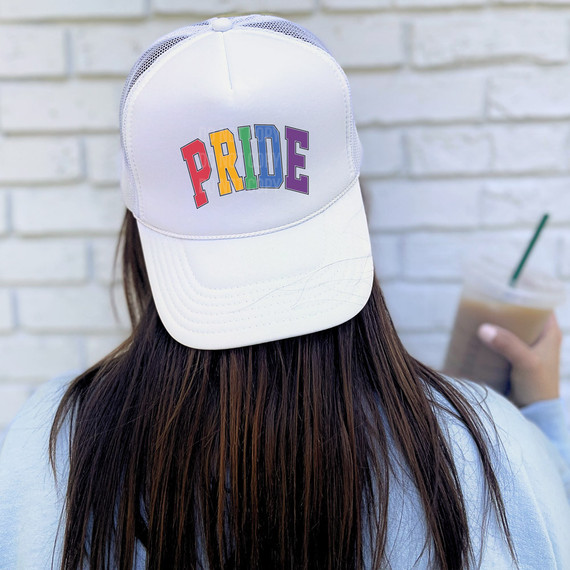 Pride Sublimation Transfer, image of a white trucker hat with colorful Pride design lettering on the front.
