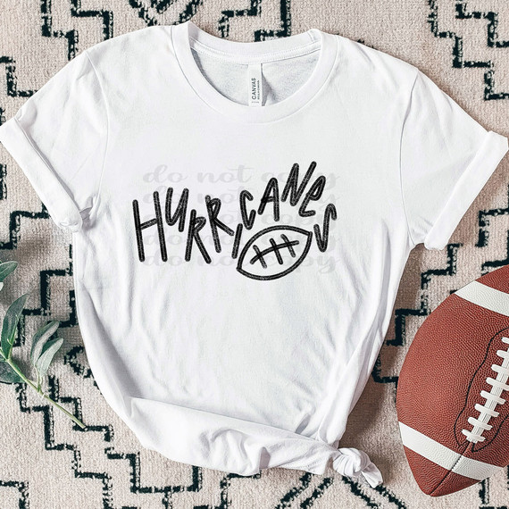 Hurricanes Football DTF Heat Transfer, white t-shirt with black football graphic and handwritten-style text design.