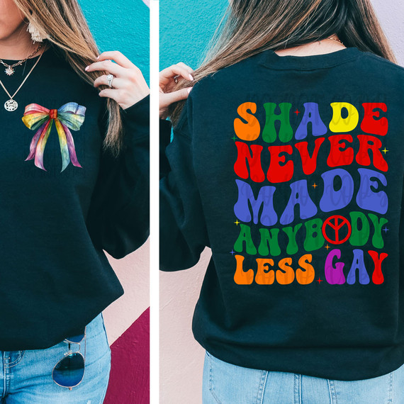 Shade Never Made Anybody Less Gay SET DTF Heat Transfer, colorful text design on the back of a black sweatshirt with rainbow colors and peace symbol.