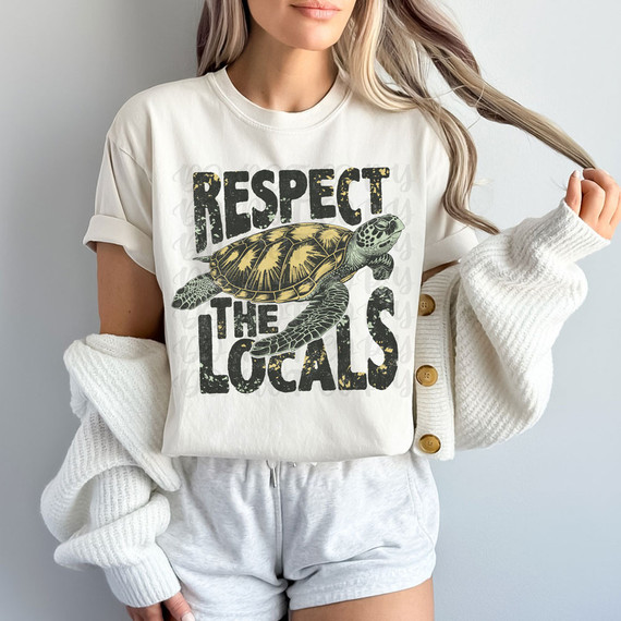 Respect The Locals DTF Heat Transfer, close-up of a woman wearing a white T-shirt with a turtle graphic and the text 'Respect The Locals' printed on it.
