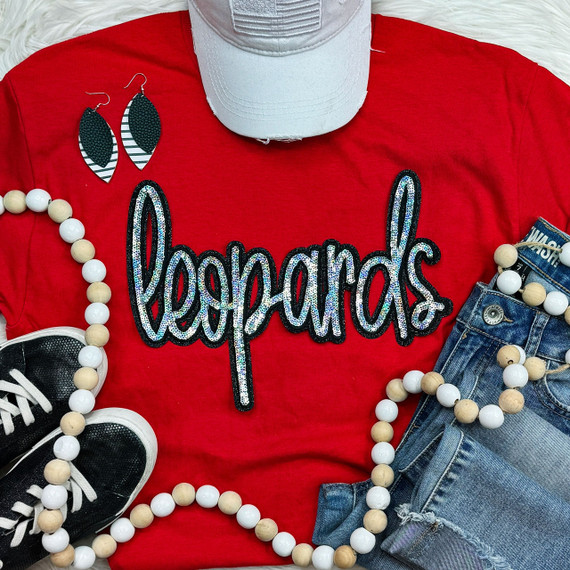 Leopards Sequin Patch, close-up of a colorful sequin leopard print patch on a red t-shirt.