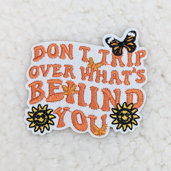 Don't Trip Over What's Behind You Embroidered Hat/Pocket Patch, colorful embroidered patch with motivational quote, butterflies, bees, and sun designs.