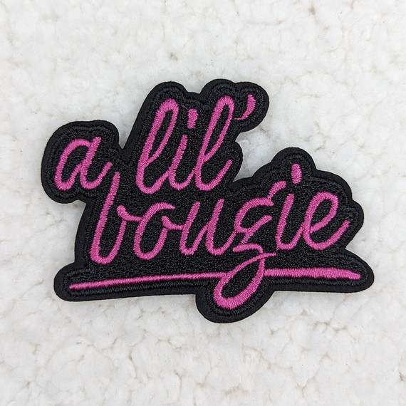 A Lil' Bougie Embroidered HAT/POCKET Patch, black and pink embroidered patch with the phrase 'a lil bougie' in cursive script.