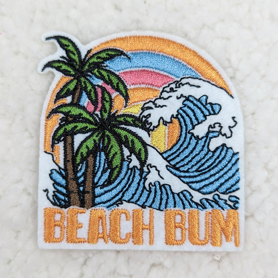 Beach Bum Embroidered HAT/POCKET Patch, colorful patch featuring palm trees, ocean waves, a vibrant sunset, and the words 'BEACH BUM' in orange embroidered text.
