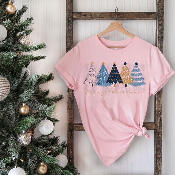 Merry Christmas Blue/Gold Trees DTF Heat Transfer, Christmas-themed pink t-shirt with blue and gold Christmas trees and the text 'Merry Christmas'.