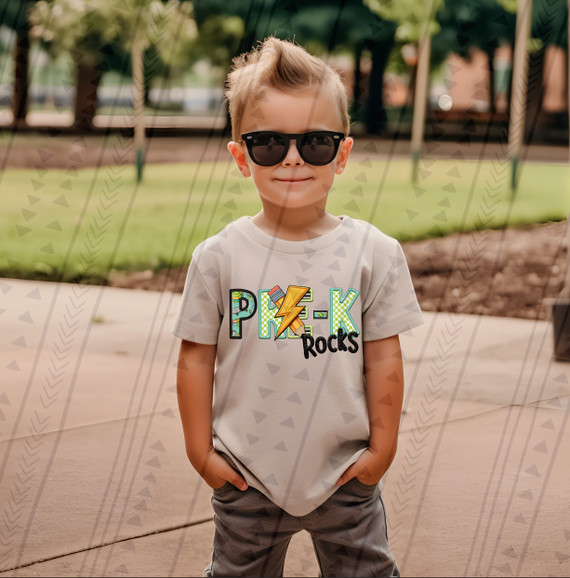 Pre-K Rocks Blue/Green DTF Heat Transfer, a colorful graphic design featuring the word 'PRE-K' with a lightning bolt and the word 'Rocks' on a child's t-shirt.