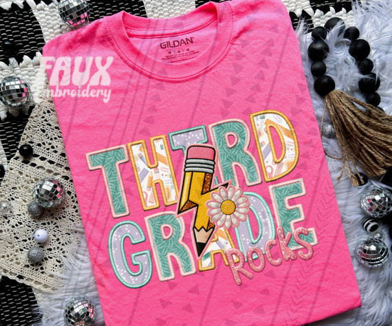 Third Grade Rocks Pink DTF Heat Transfer, colorful and decorative heat transfer design on a pink t-shirt with fun graphics