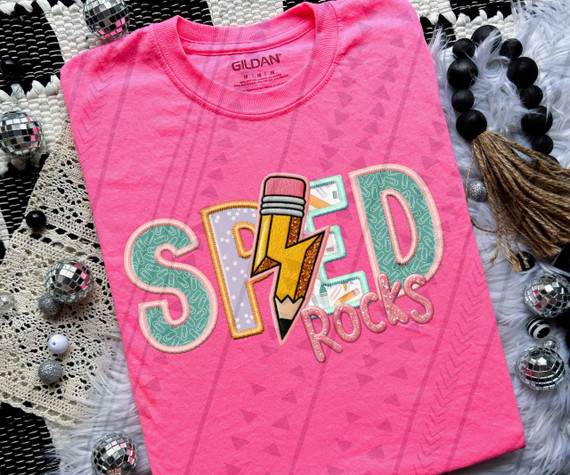 Sped Rocks Faux Embroidery DTF Heat Transfer, pink T-shirt with a colorful 'SHED ROCKS' design featuring a pencil with a lightning bolt, surrounded by decorative beads and textured background.