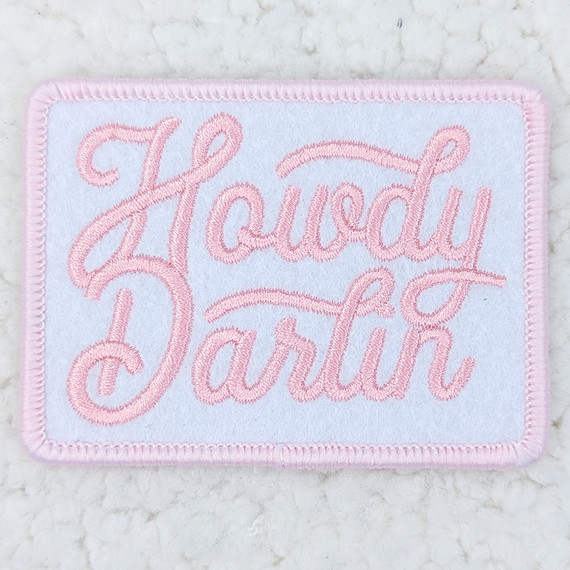 Howdy Darlin PINK Embroidered HAT/POCKET Patch, pink embroidered patch with the brand name 'Howdy Darlin' stitched in cursive on a white background with a pink border.