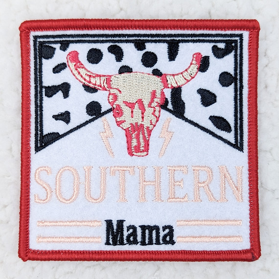 Southern Mama Embroidered HAT/POCKET Patch, patch featuring a cow skull with horns, black and white leopard print background, pink and black embroidered text, and decorative lightning bolts.