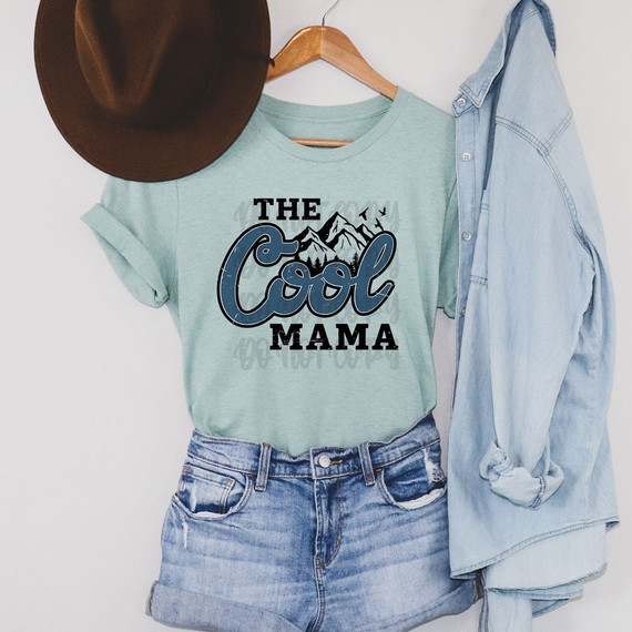 The Cool Mama DTF Heat Transfer, a graphic design featuring mountains and the text 'The Cool Mama' on a mint green t-shirt.