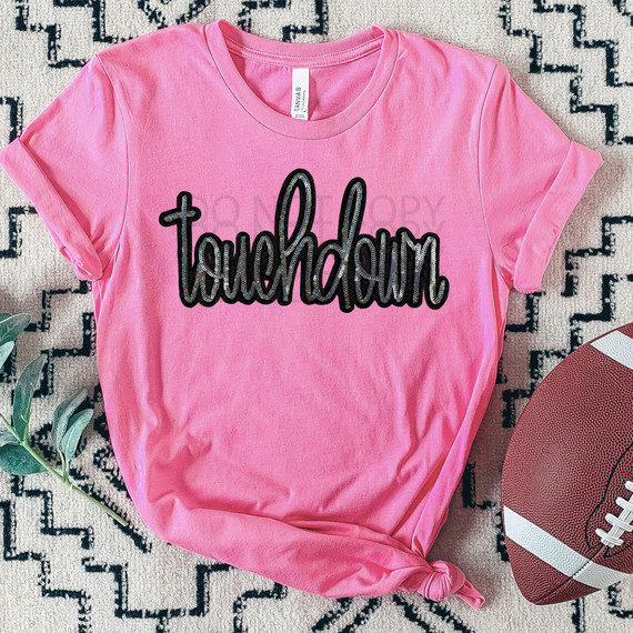 Touchdown Faux Sequin Patch DTF Heat Transfer, pink t-shirt with black sequin embroidered 'touchdown' text logo.