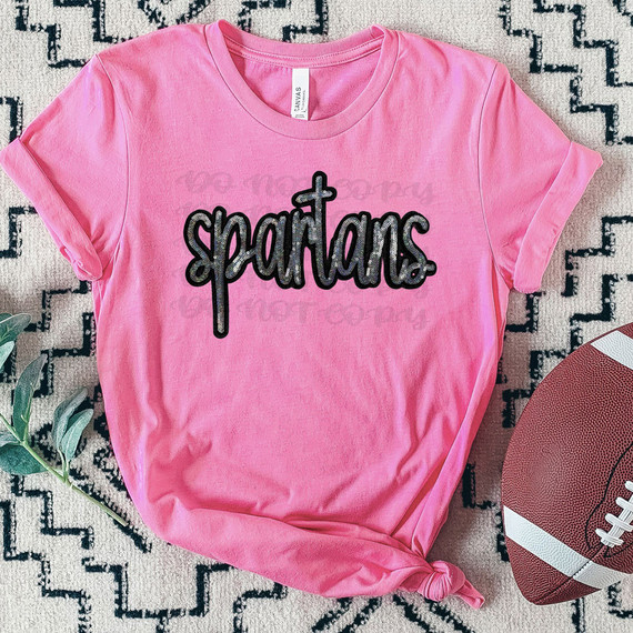 Spartans Faux Sequin Patch DTF Heat Transfer, pink T-shirt with black sequined Spartans patch on front.