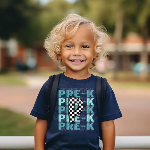 Pre-K Checker DTF Heat Transfer, a colorful and eye-catching graphic design featuring the words 'PRE-K' repeated with a checkered question mark in the center, applied to a navy blue T-shirt worn by a smiling young boy.