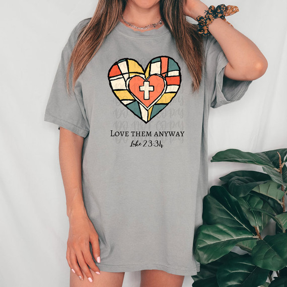 Love Them Anyway DTF Heat Transfer, colorful heart with cross design on a gray T-shirt.