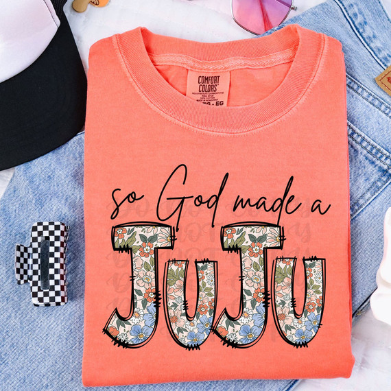 So God Made A Juju DTF Heat Transfer, floral patterned text with the phrase "so God made a JUJU" on a coral-colored t-shirt.