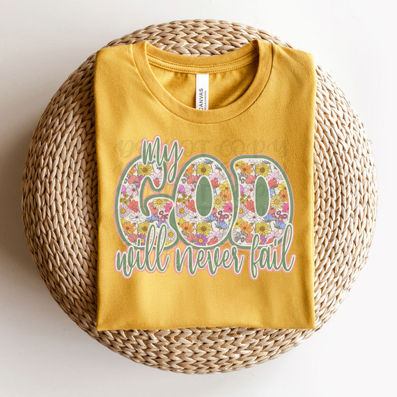 My God Will Never Fail Floral DTF Heat Transfer, yellow t-shirt with a colorful floral design and motivational message.