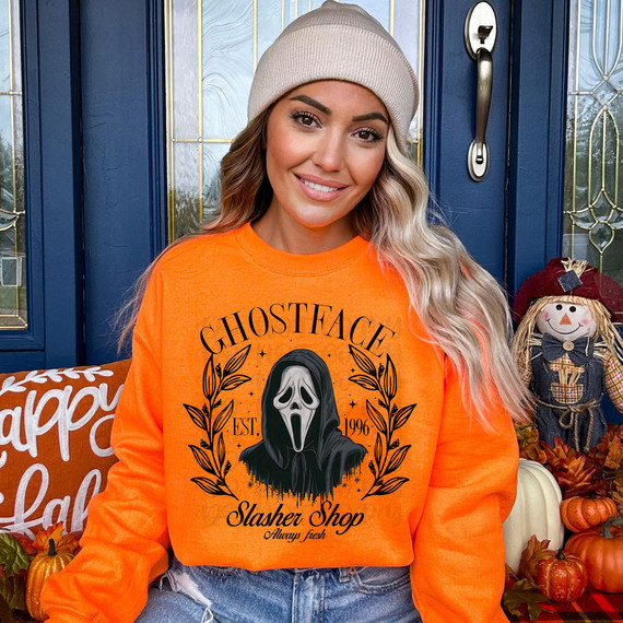 Slasher Shop Coquette DTF Heat Transfer, Halloween themed graphic featuring Ghostface from Scream on an orange sweatshirt.