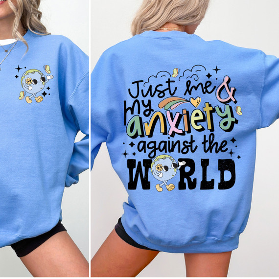 Me And My Anxiety Against The World SET DTF Heat Transfer, blue sweatshirt with colorful and playful text and illustrations promoting mental health awareness.